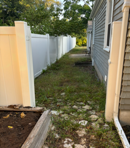 "Before" photo of a small backyard transformation.